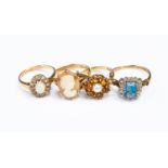 Four 9ct gold vintage stone set rings, including a blue stone set cluster,