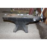 A black painted cast iron anvil