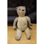 Yellow straw jointed Teddy Bear