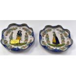 A pair of 19th Century Quimper fluted plates,
