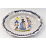 An early to mid 19th Century Quimper Breton platter measuring 34 x 26 cms unmarked with early