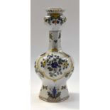 A mid 19th Century French Faience vase decorated with blue flowers and yellow bands circa mid 19th