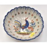 A 19th Century Nevers Faience scalloped edge bowl, with cockerel to centre, 24 cms diameter,
