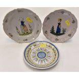 A HB Quimper plate, with a scalloped rim decorated with a Lady and floral sprays,