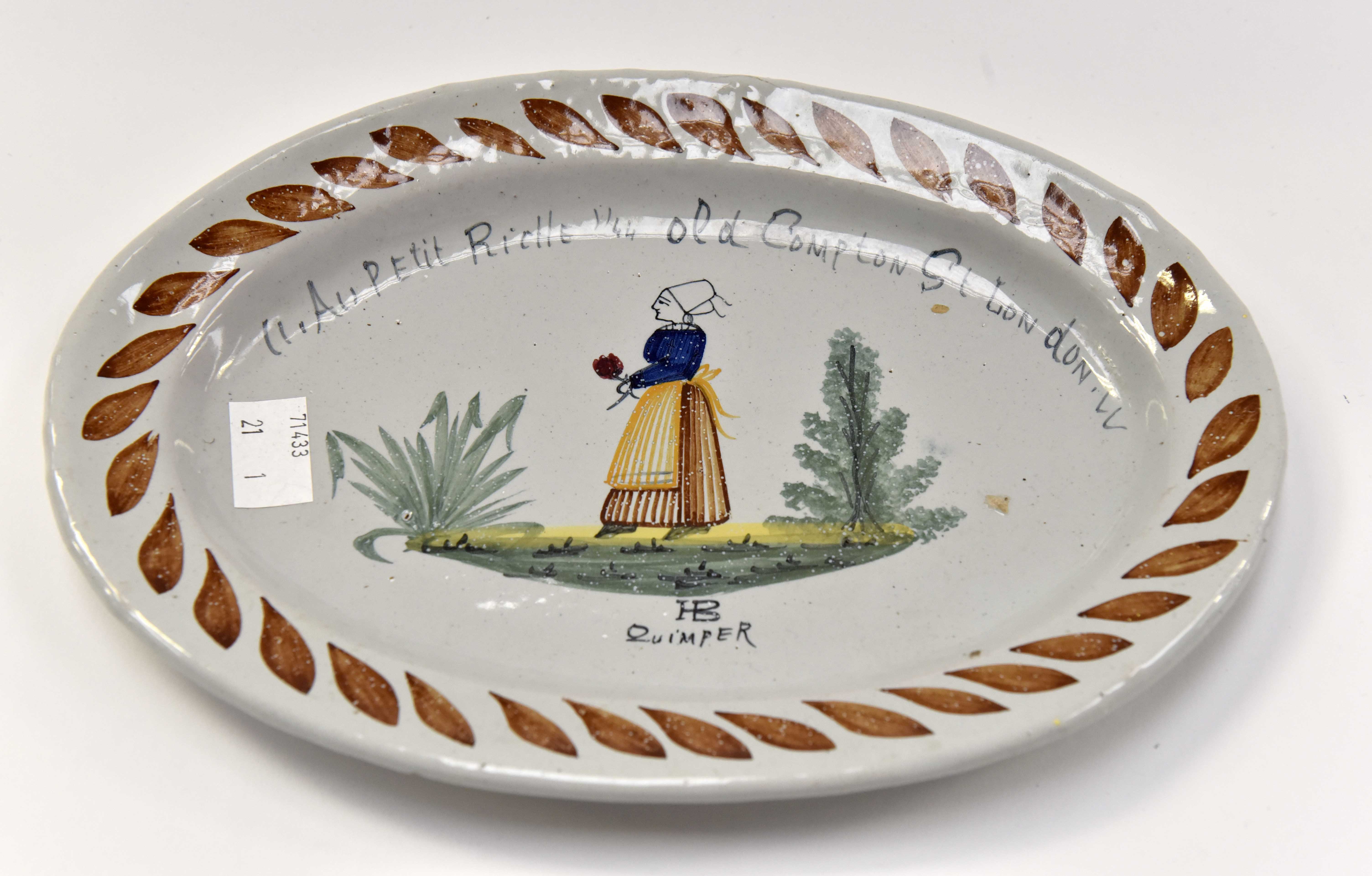 H.B Quimper oval plate. girl holding flower design.