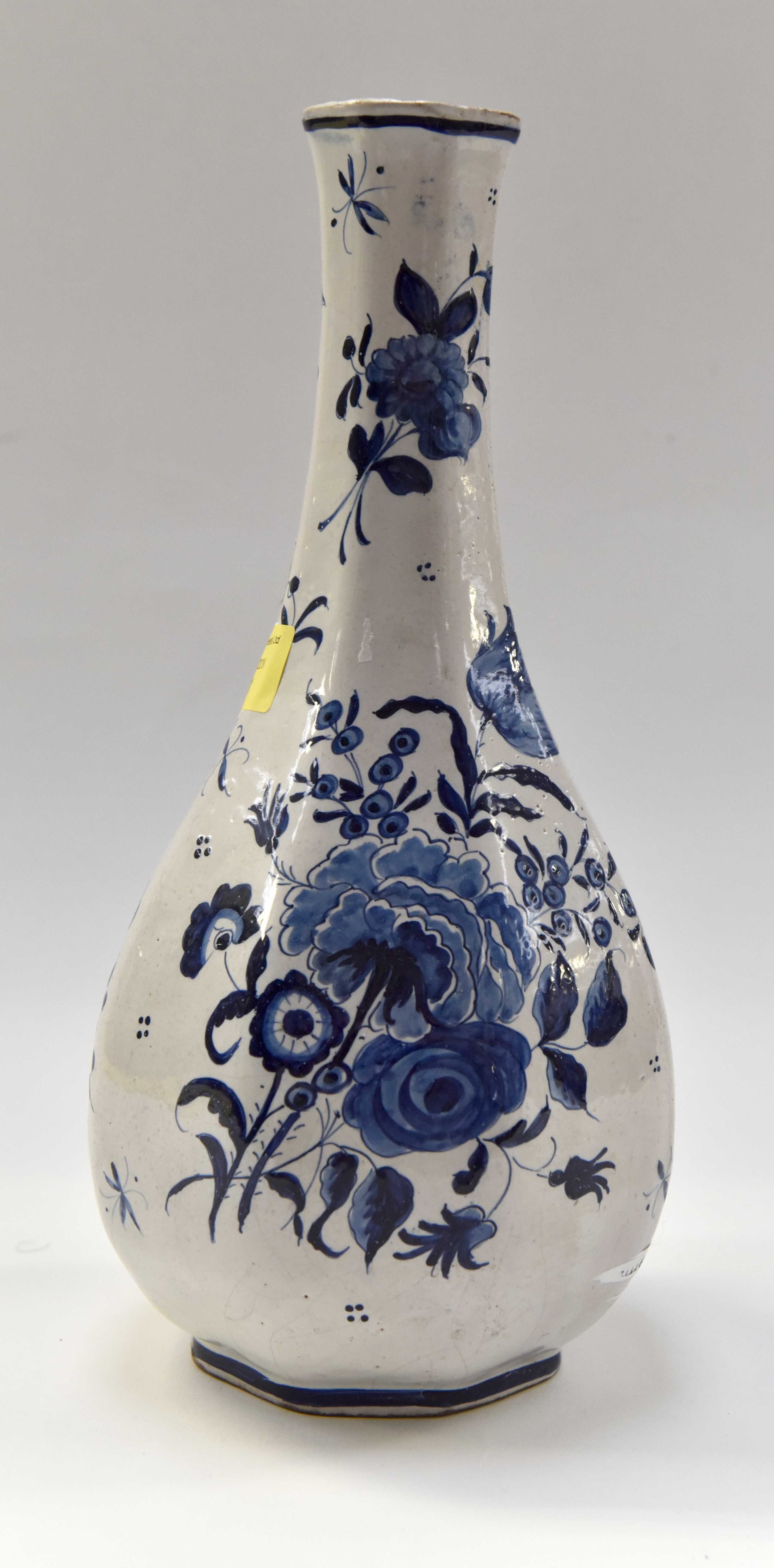 An 18th Century Camaieu blue French Faience vase measuring 30 cms high with blue floral overglaze
