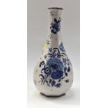 An 18th Century Camaieu blue French Faience vase measuring 30 cms high with blue floral overglaze