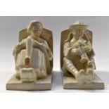 A rare pair of Henri Dellourt Faiece book ends of a boy and girl, the boy playing pipes,