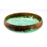 Monart shallow bowl, green base, orange/ yellow, black and gold adventurine rim Condition: No