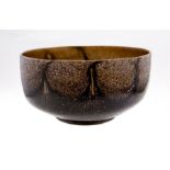 Monart stoneware bowl brown body with pulled trailing, red, white, green inclusions c.1930. Monart