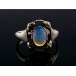 Murrle Bennett & Co - An Arts and Crafts silver and opal ring, size M, stamped M.B.C, 2.5gms