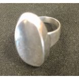 N.E.From silver modernist ring c.1950 plain oval concave form, dimensions approx 25mm x 14mm. Ring