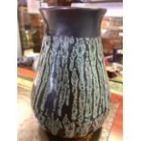 A Lockhead Kirk Cudbright Scottish studio pottery vase with brown and green glaze. Height 12.5cm