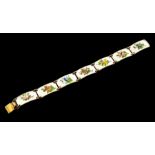 Finn Jensen - a Norwegian silver and enamel bracelet, seven panels painted with colourful flowers on
