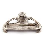 An electro plated silver art nouveau style inkwell, with floral design, circa 1900. Missing ink