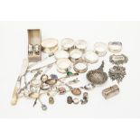 A collection of silver including a Victorian napkin rings and a silver and mother of pearl butter