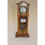 An Art Nouveau miniature wooden longcase clock,