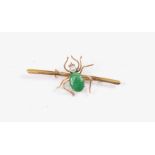 A spider set brooch, jade coloured stone set body, pearl head, mounted in 14ct gold,