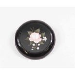 A Pietra dura brooch, circular form with inlaid pink rose and lily of the valley motif,