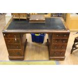 A Victorian walnut twin pedestal writing desk, leather inset top,