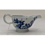 A Vauxhall blue and white sauce boat with a fluted body,