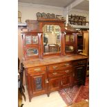 A Victorian mahogany mirror backed sideboard, four drawers over three cupboard doors,