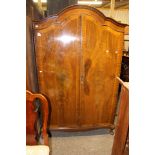 An early 20th Century walnut double wardrobe, in the Queen Anne style,