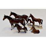 Two Bay Beswick horses together with a foal and a pony, largest measures, 21 cms approx,
