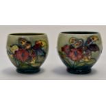 Two small Moorcroft round vases,