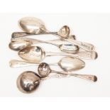 A George III Fiddle pattern caddy spoon, London, 1815 together with various condiment spoons,
