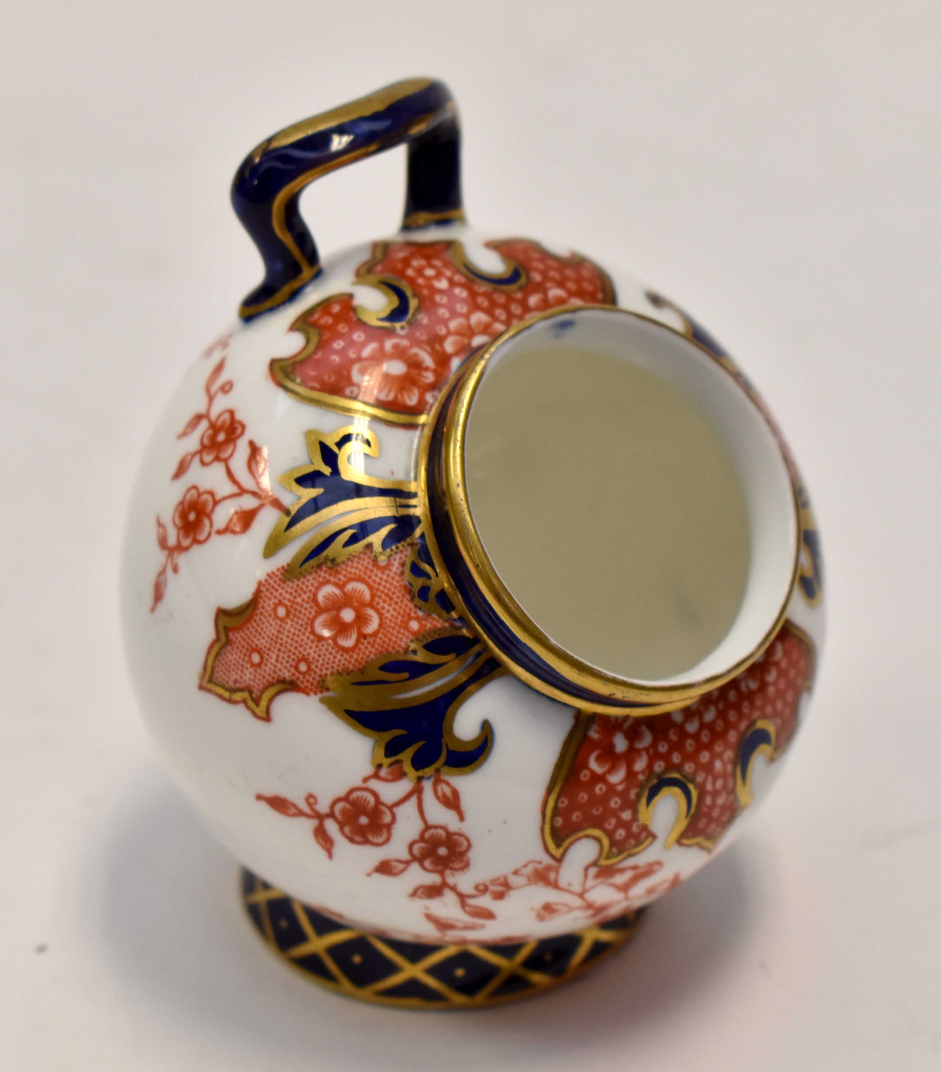 A Royal Corwn Derby miniature salt pig, imari pattern,