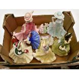 A collection of Royal Doulton figures along with a Royal Worcester figure,