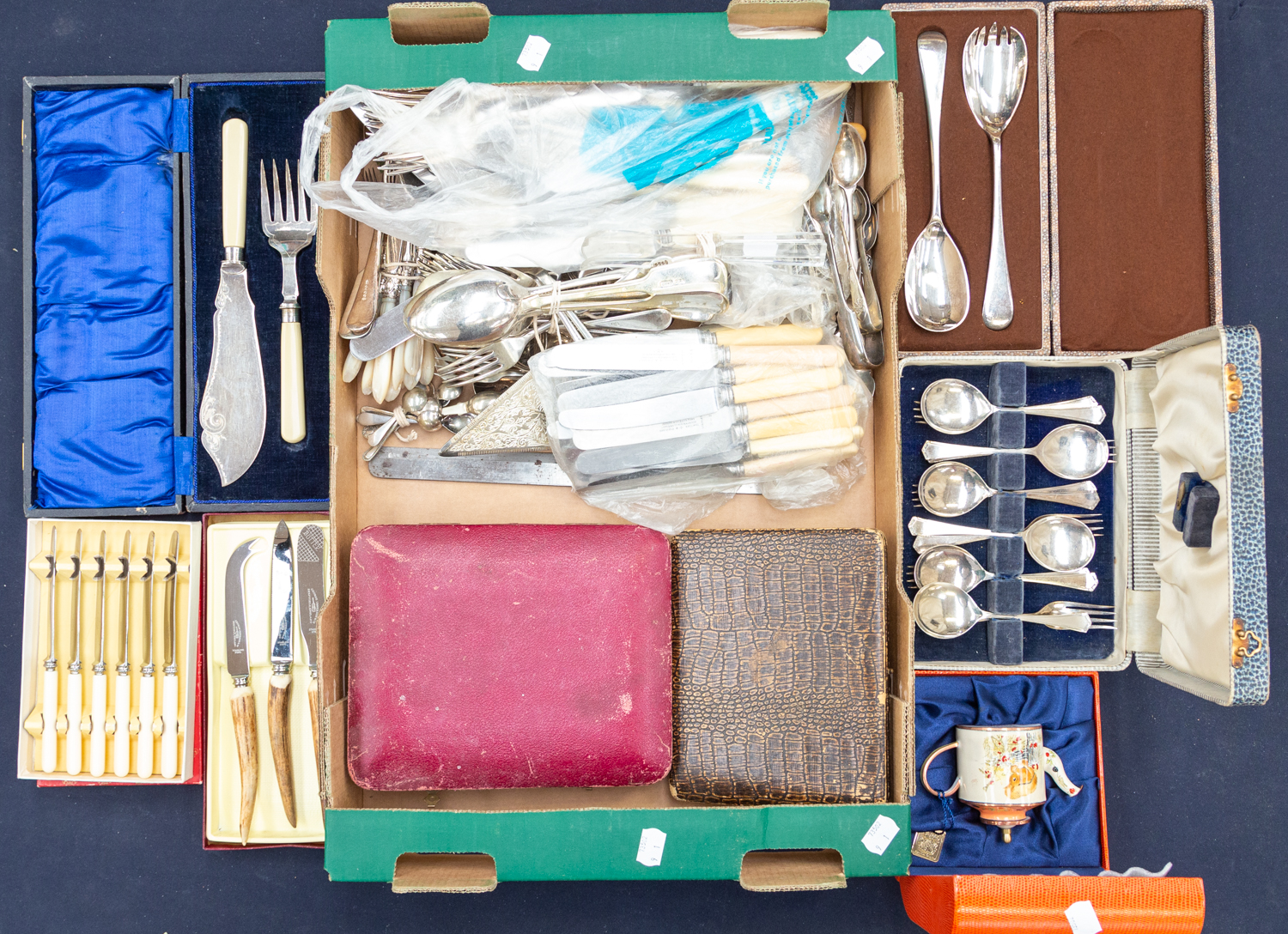 A box of plated flatware etc and a Goebels collectable watering can