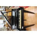 A vintage ebonised childs piano