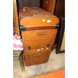 Two brown metal trunks,