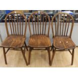 A part set of three elm seated stick back chairs, beech frames,