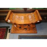 A Ghanian hardwood prayer stool, hand carved throughout,