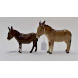 Two Beswick donkeys, taller 13 cms high approx, the other 10 cms high approx.