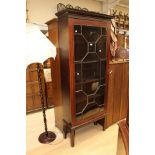 A Georgian mahogany display cupboard on a later stand.