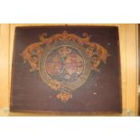 A 19th Century heraldic crest painted on board,