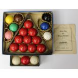 One set of small snooker balls and one set of billiard balls