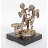 Chamber stick, depicting two winged cherubs,