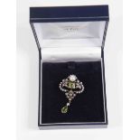An Edwardian seed pearl and peridot brooch, open work foliate design set with seed pearls,