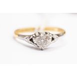 A diamond set dress ring, heart shaped mount set with a small brilliant cut diamond,