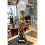 A Spelter figural lamp with glass shade