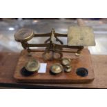 A Victorian brass set of postal weighing scales and weights