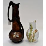 Late 19th century jug with face mask handle and corn/wheat detail along with Bretby jug with Bee