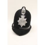 A Derbyshire Constabulary Policemans blue cloth helmet. Queens Crown badge.