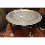 An early Twentieth century small North African brass topped table.