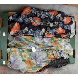 A collection of 1930s dressing gowns and robes, one is blue floral with orange flowers,